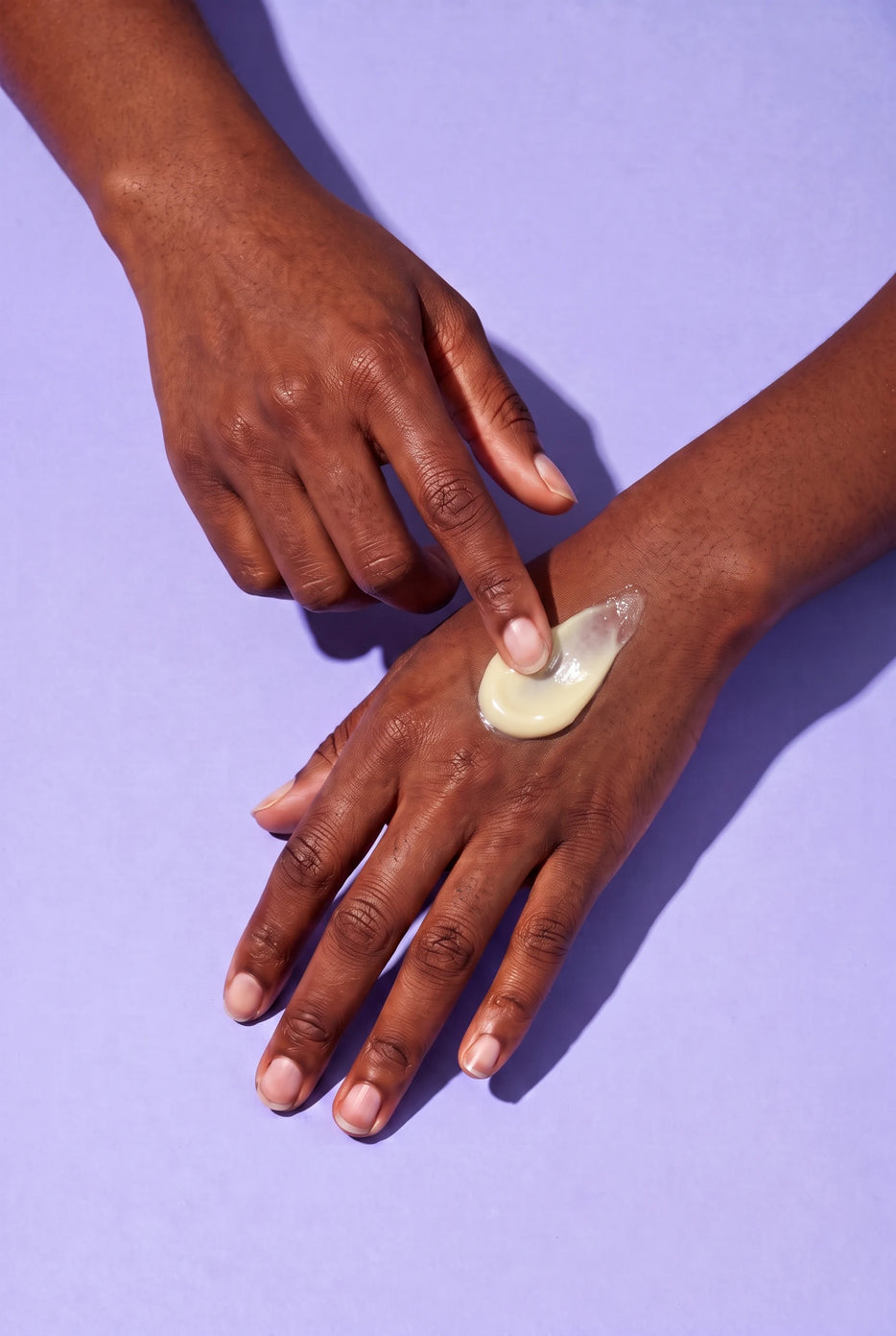 Model holding Inclū Balancing Moisturizer
